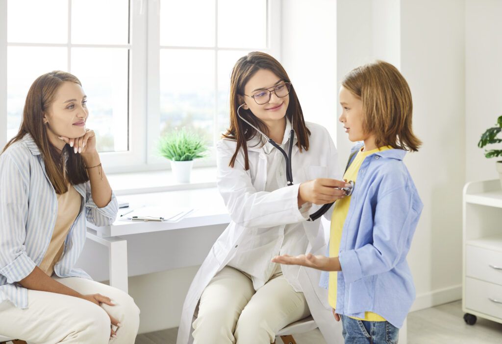 Mother and daughter visiting their family doctor