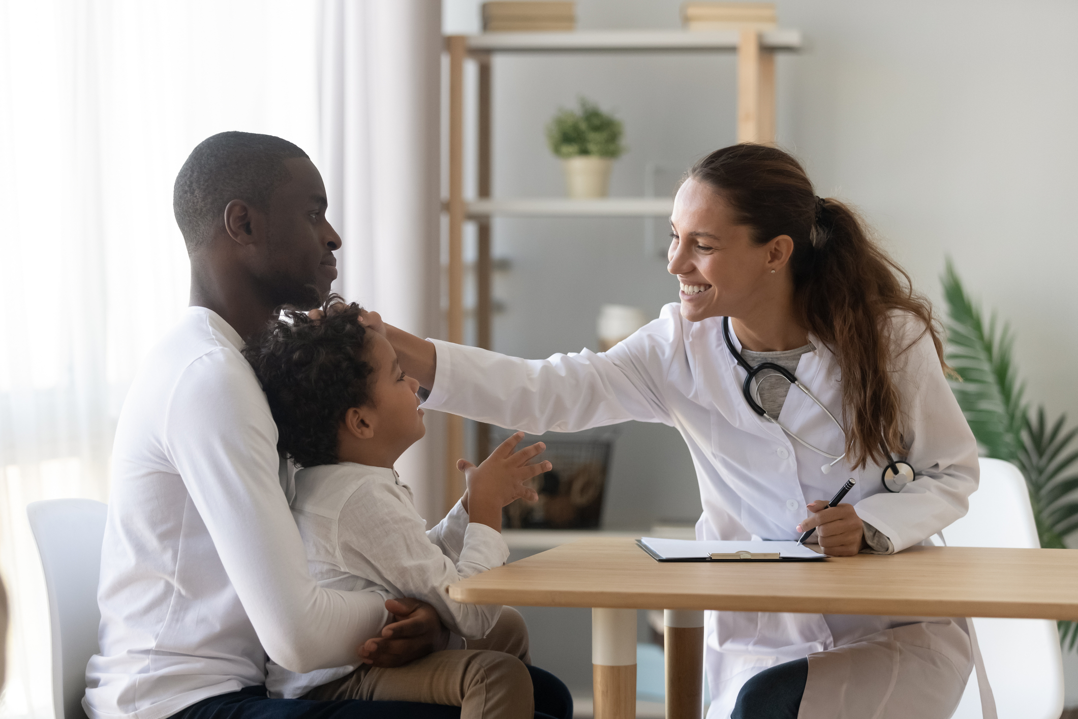 Nurse with father and child